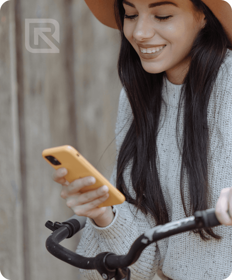 A cyclist using the ReBin app, the brand mark watermarked over the photo